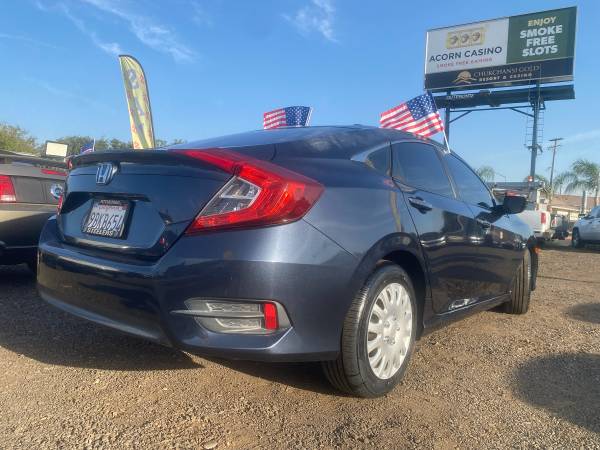 2017 Honda Civic LX 4dr Hatchback CVT — photo 4